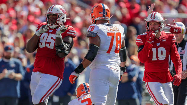 Wisconsin nose tackle Keeanu Benton celebrates a sack against Illinois.